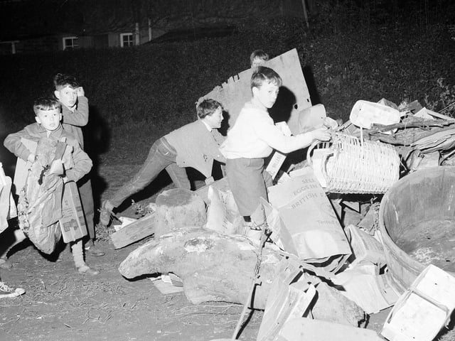 Children piling up their bonfire at Silverknowes, 1960s.