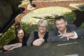 David Jamieson, with Claire Telfer from Save The Children, and Councillor Karen Doran, at the official opening of the floral clock in Princes Street Gardens in 2019