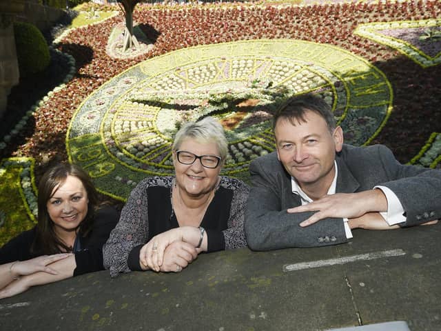 David Jamieson, with Claire Telfer from Save The Children, and Councillor Karen Doran, at the official opening of the floral clock in Princes Street Gardens in 2019