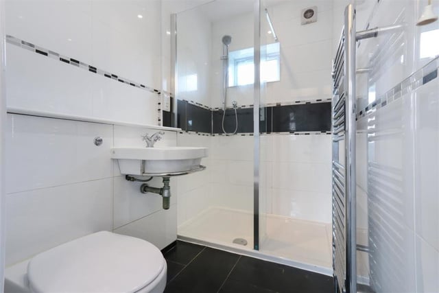 The ensuite attached to bedroom two continues the monochrome theme to the decor which prevails throughout the house.
