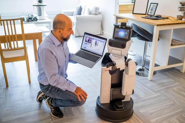 Dr Mauro Dragone with Toyota’s Human Support Robot.