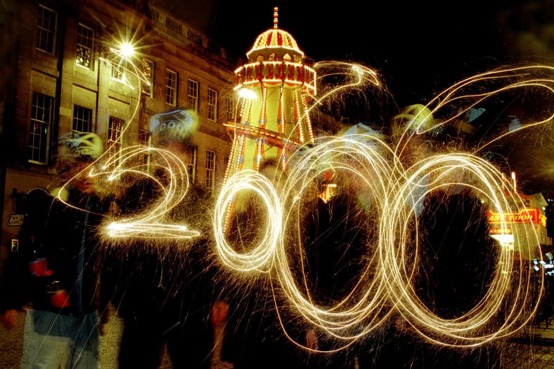 Youngsters "paint" the numbers 2000 with sparklers as Millennium Hogmanay celebrations get underway in Edinburgh.