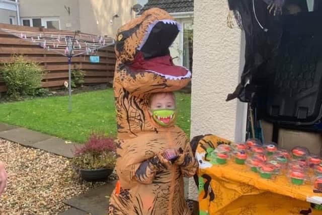 Mhairi, 5,  marauded her way as a T-rex to the tuck shop