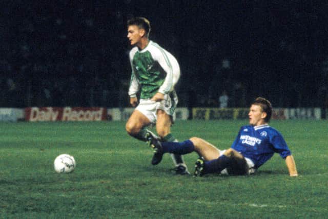 Gordon Hunter evades a tackle by Stuart McCall of Rangers as Hibs beat the Gers 1-0 to advance to the Skol Cup final in 1991