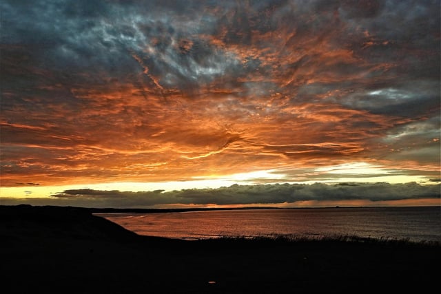 Sunset towards Budle Bay, taken from Bamburgh.