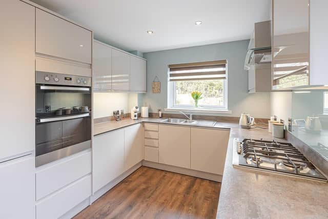 The property features this practical kitchen with contemporary vibes.