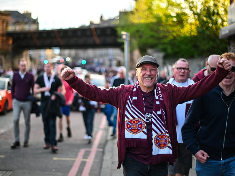 Hearts fans react outside the stadium after their team's victory (Photo by ANDY BUCHANAN / AFP via Getty Images)