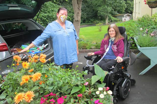 Laura Kearney delivering the plants to Susanne Watson at Drummond Grange.