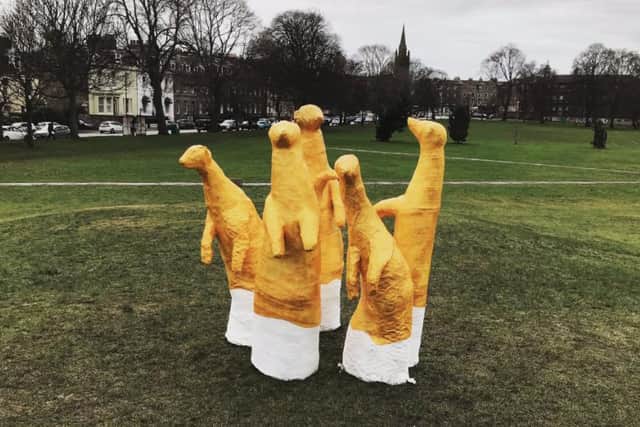 The appearance of five giant golden meerkats on Leith Links on Monday has left locals scratching their heads. (Credit: Craig Salter)