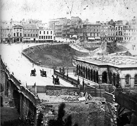 View of Waverley Bridge looking towards Princes Street and showing construction works for Cockburn Street in foreground.