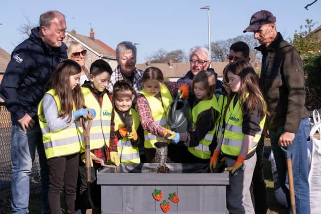 Danderhall pupils with Kevin Moreland of Stewart Milne Homes and Guerrilla Gardeners.