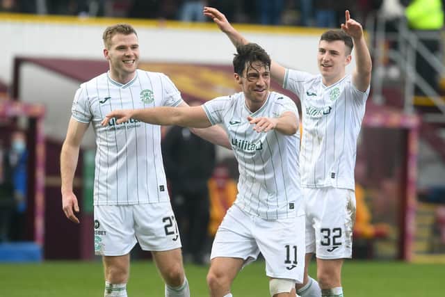 Joe Newell celebrates with the fans at full time at Fir Park