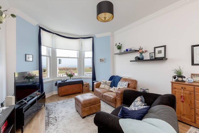 The stunning living/ dining room offers great sea views from the comfort of your sofa.