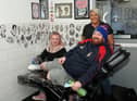 Derek Marr with tattooist Shannon Jamieson and Lynette Shields, owner of Nettie's takeaway
