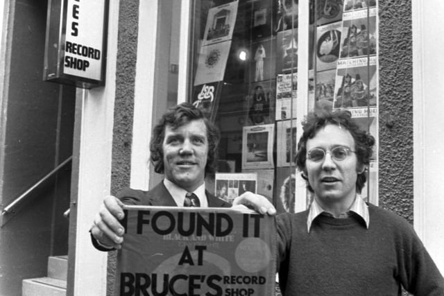 Edinburgh folk still talk about city record store Bruce's, which was the place to go for the latest tunes. Pictured are Brian Findlay and Bruce Findlay with the distinctive red carrier bag 'I Found It At Bruce's' outside Bruce's record shop in Rose Street in November 1972