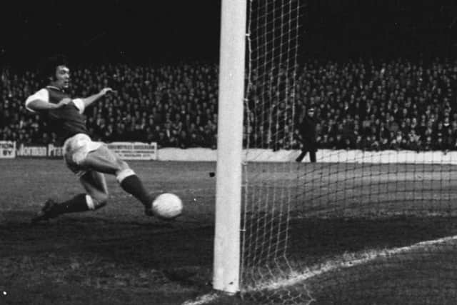 Jimmy O'Rourke slides in to make it 6-0 to Hibs during the famous 7-0 win at Tynecastle in 1973. Picture: SNS