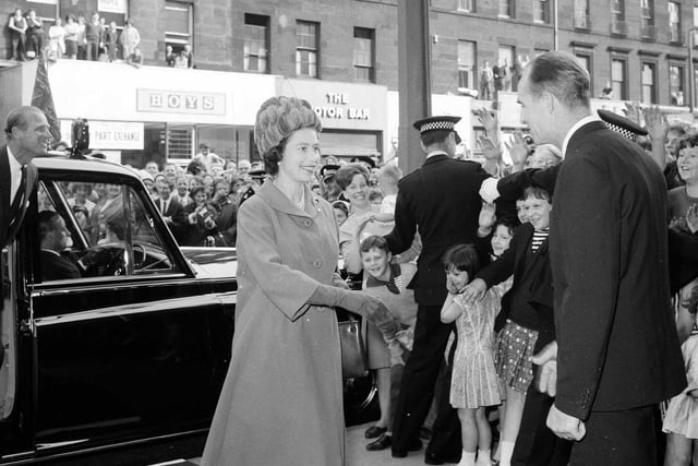 The Queen arrives at Edinburgh's ABC Cinema to see the film of the opening of the Forth Road Bridge in September 1964.