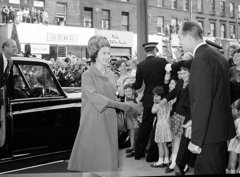 The Queen arrives at Edinburgh's ABC Cinema to see the film of the opening of the Forth Road Bridge in September 1964.