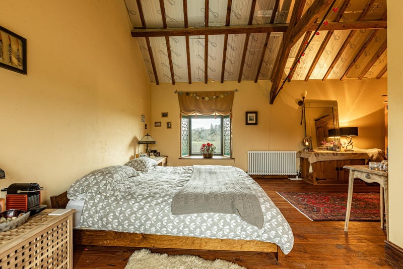 One of the property's very large bedrooms, with lots of space to get ready in the morning and for as big a bed as you could imagine to enjoy a lovely sleep.