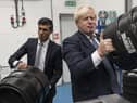 Boris Johnson and Rishi Sunak get the beers in during a visit to Fourpure Brewery in London. Photo: Dan Kitwood/PA.