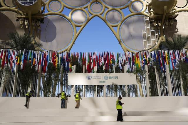 Workers prepare an area at the COP28 UN Climate Summit in Dubai (AP Photo/Rafiq Maqbool)