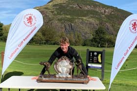 Castle Park's Connor Wilson shows what winning the Evening News Trophy means to him after his title triumph at Prestonfield