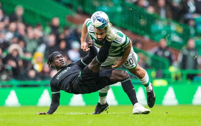 Elie Youan was shown a second yellow card after this challenge with Celtic's Cameron Carter-Vickers as Hibs lost at Celtic Park. Picture: SNS