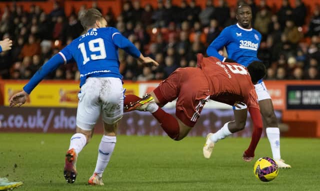 Aberdeen forward Bojan Miovski is fouled by James Sands during Rangers' win at Pittodrie earlier this season. Picture: SNS