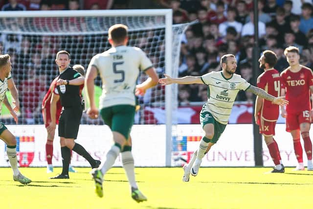 Adam Le Fondre wheels away after scoring the opener in Hibs' 2-0 win against Aberdeen at Pittodrie. Picture: Paul Phelan / SNS Group