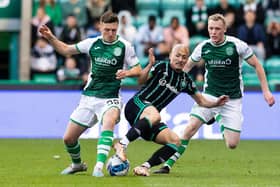 Hibs midfielder pair Josh Campbell and Jake Doyle-Hayes combine to stop Celtic forward Daizen Maeda in his tracks at Easter Road