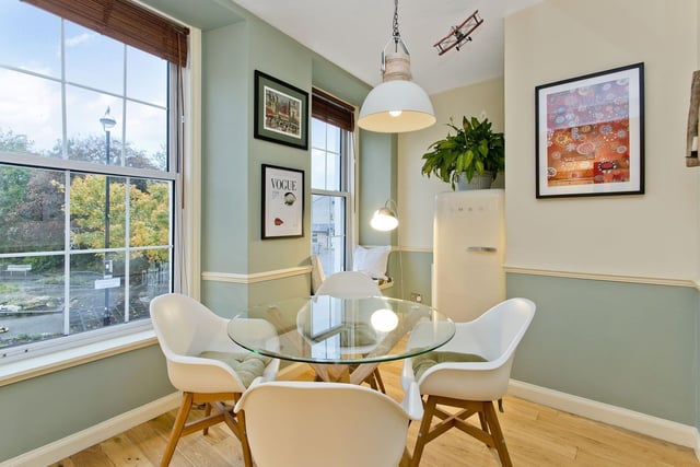Space is provided in the kitchen for a seated dining area.