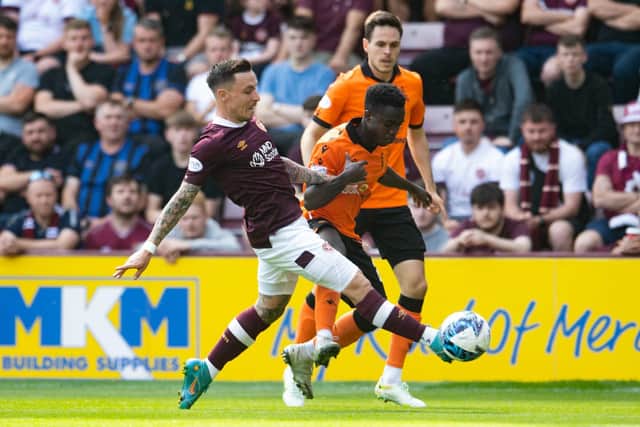Barrie McKay gets in front of Dundee United's Mathew Cudjoe at Tynecastle Park. Picture: Ross Parker / SNS