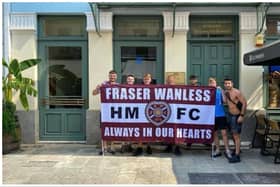 A group of Hearts supporters from Edinburgh proudly display their flag tribute to Fraser Wanless on a trip to Greece.