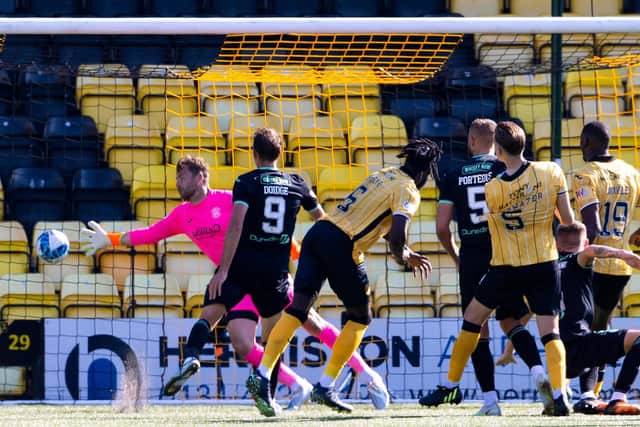 Ayo Obileye heads beyond Hibs goalkeeper David Marshall for a late winner at the Tony Macaroni Arena. Picture: SNS