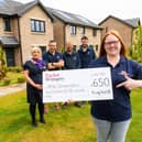 RNLI representatives were on hand to receive a cheque from TW Sales Executive Helen Allenby. Pictured from the RNLI are - Stuart Ebdy (dark hair, beard), Adele Allan, Chris Brydie (shorts) and Andrew Ventham (glasses, beard).