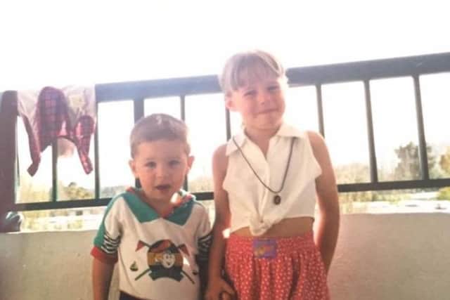 Sam and his big sister as children.