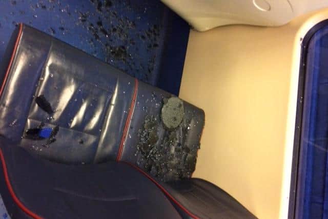 Images sent to the Evening News show glass strewn across seats on an Edinburgh Tram after a 'rock' was thrown at the window