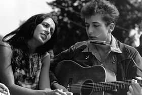 Bob Dylan perform, seen with Joan Baez in 1963, famously asked 'how many streets must a man walk down?' in his song Blowin' in the Wind (Picture: Rowland Scherman/National Archive/Newsmakers)