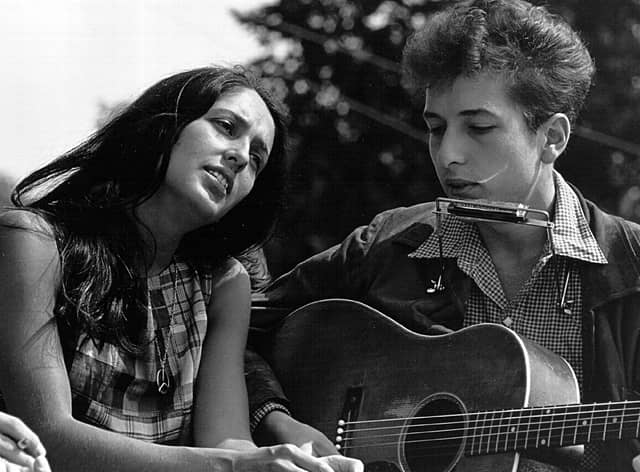 Bob Dylan perform, seen with Joan Baez in 1963, famously asked 'how many streets must a man walk down?' in his song Blowin' in the Wind (Picture: Rowland Scherman/National Archive/Newsmakers)