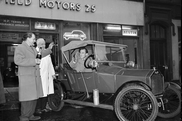 A vintage 1913 Humberette car is pictured at the Bruntsfield Motors garage ahead of its journey to the Rootes Motor Museum in London in 1958.