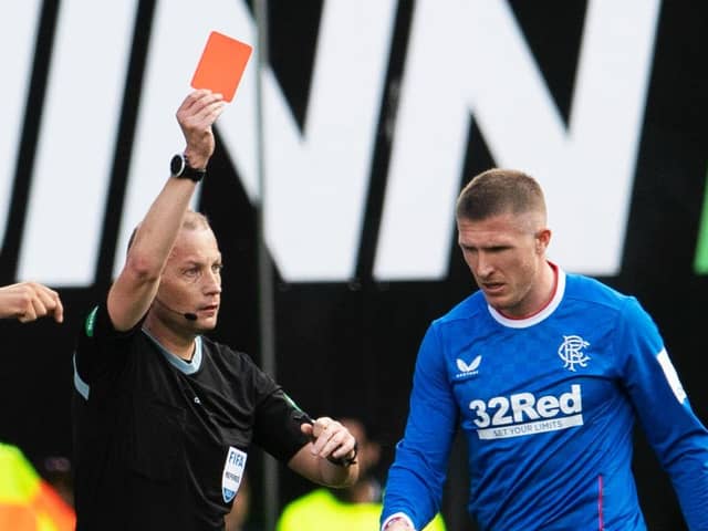 Referee Willie Collum shows Rangers midfielder John Lundstram a red card during the 2-2 draw with Hibs at Easter Road