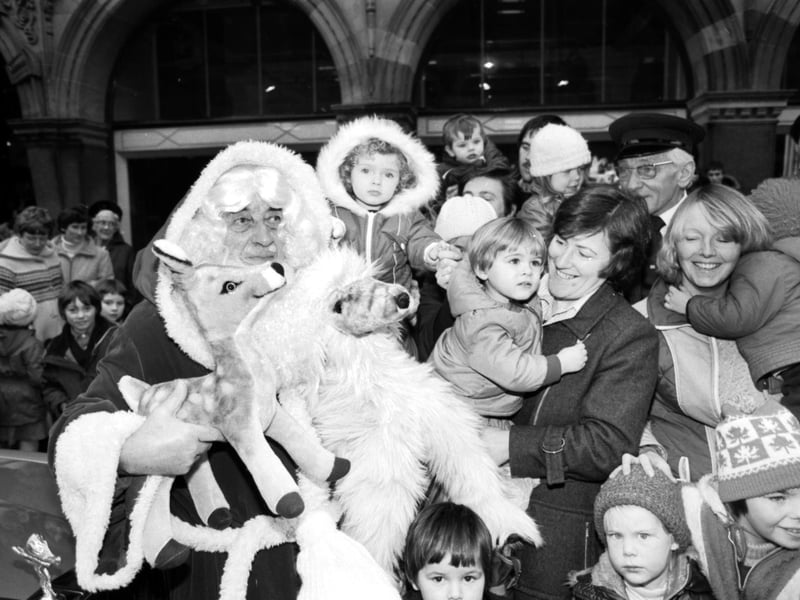 The Jenners Santa Claus arrives at the Edinburgh department store to be met by parents and children in November 1980.