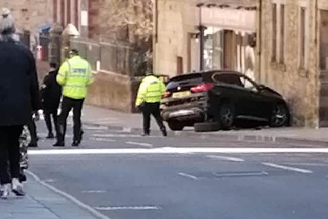 The crash happened in the Canongate on Wednesday morning.