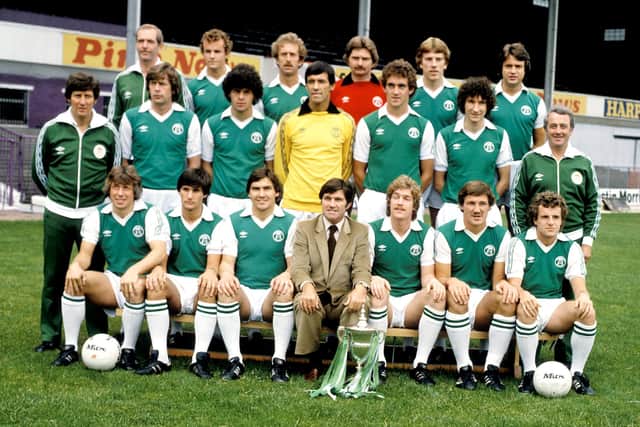 Auld and the Hibs team pose with the First Division trophy at Easter Road