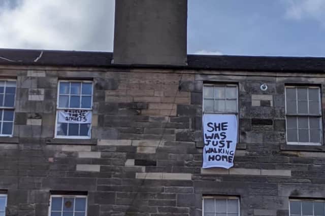 A sign in Edinburgh reading 'She was just walking home' in reference to Sarah Everard.