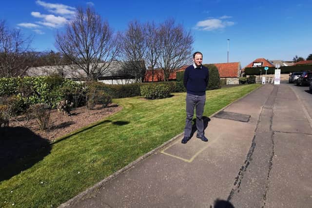 Local Labour councillor Scott Arthur at the site of the proposed mast.