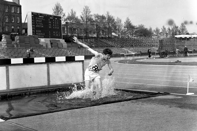 The Edinburgh Universities Athletics meeting at Meadowbank Stadium in May 1970 - A Dean falls in the 3000 metres steeplechase.
