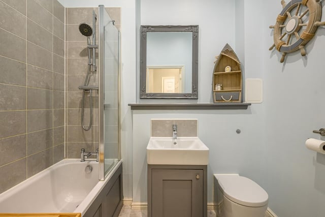 The spacious bathroom also features a crisp white three piece suite
Photo: Neilsons and Planography