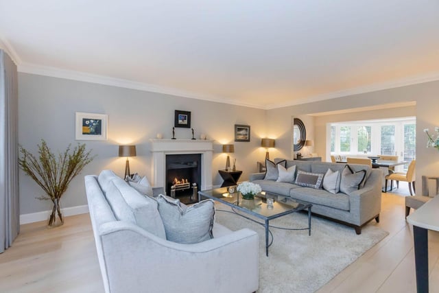 The elegant open plan living/dining room boasts wooden flooring and a living flame gas fire creating a wonderful focal point in the room. Access to the enclosed rear garden is provided through French doors.