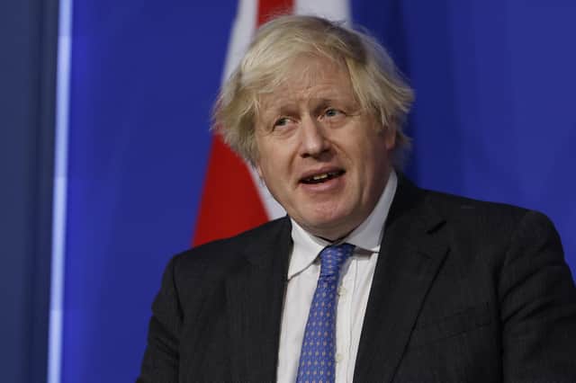 Boris Johnson's government has launched a full-frontal funding attack on the BBC (Picture: Tolga Akmen/pool via AP)